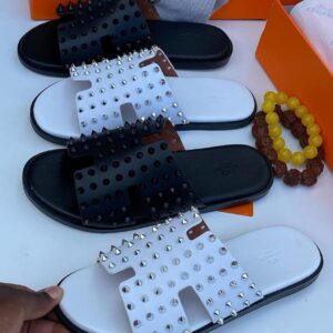 Dior Studded Sandals – bold Parisian edge.
