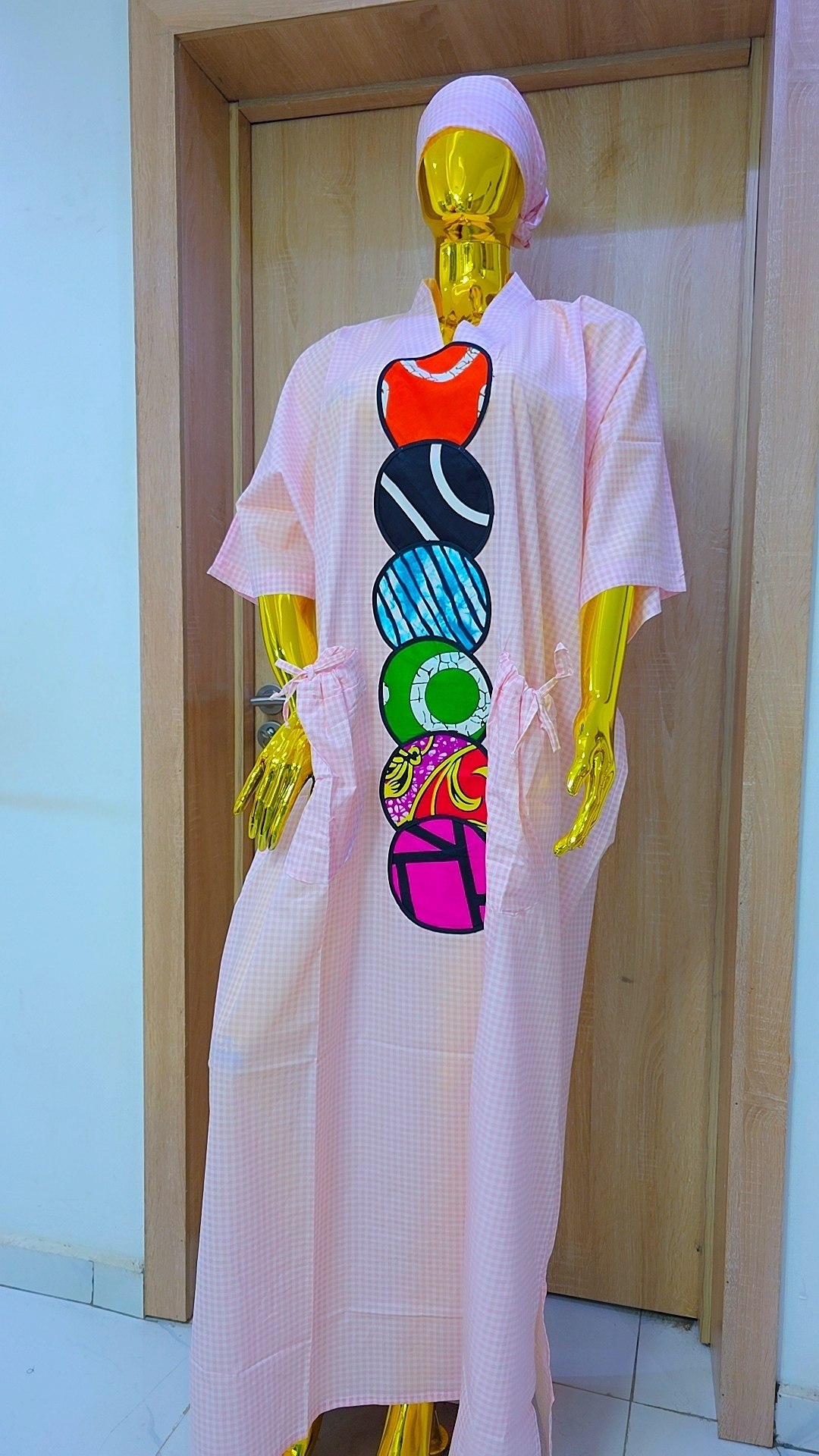 Elegant Checkered Gown with Vibrant Patterned Circular Accent