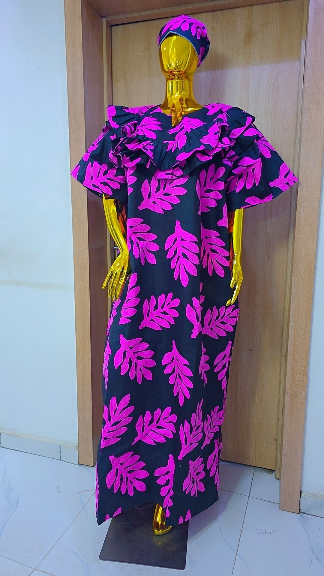 Bold Leaf-Print Gown with Ruffled Neckline Detail