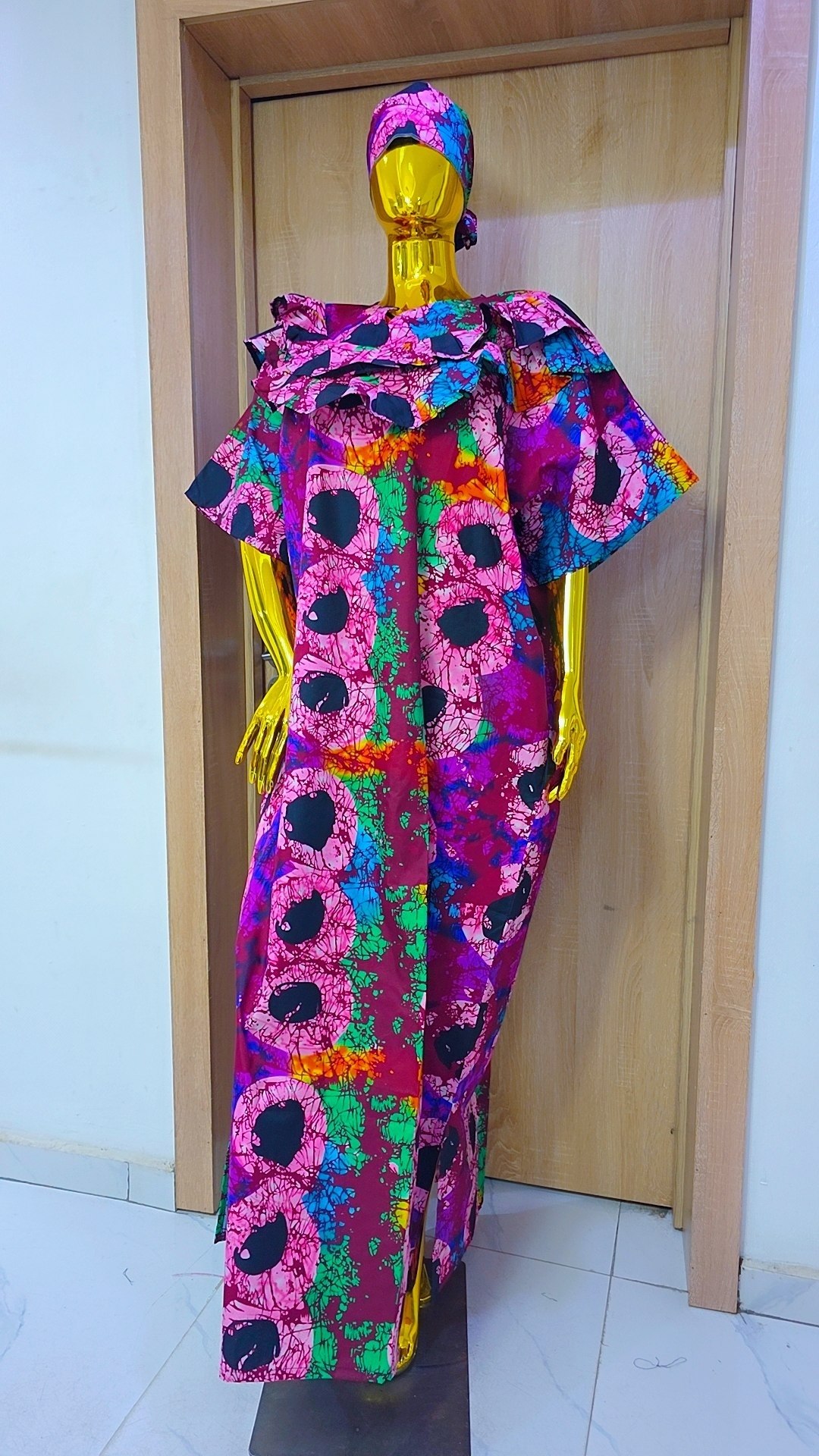 Bold Leaf-Print Gown with Ruffled Neckline Detail
