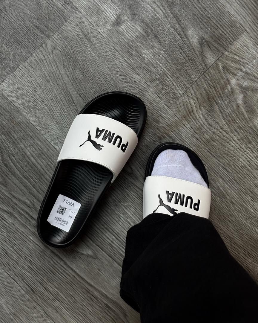 Stylish Black Puma Slides with White Branding