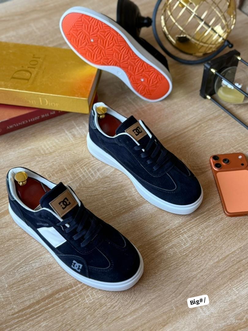 DC Shoes Black & White Low-Top Skate Sneakers with Orange Sole